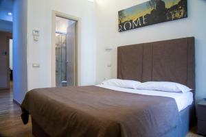 Postel nebo postele na pokoji v ubytování Rome Armony Suites
