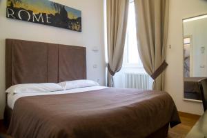 Postel nebo postele na pokoji v ubytování Rome Armony Suites