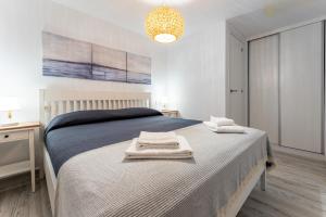Ein Bett oder Betten in einem Zimmer der Unterkunft Rocas del Mar