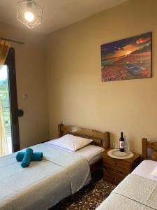 A bed or beds in a room at ''Mary's House'' Entire residence Olympiada Halkidiki Near to Sea 200m !