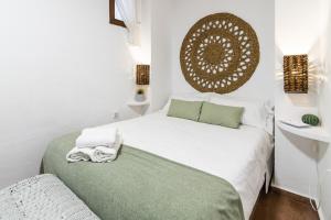Posteľ alebo postele v izbe v ubytovaní Lightbooking Cordoba Plaza Corredera