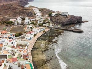 an aerial view of a small town on the coast at Lightbooking Aloe Las Playitas Beach in Las Playitas