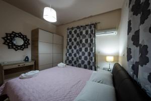 Postel nebo postele na pokoji v ubytování Nadia Apartments A