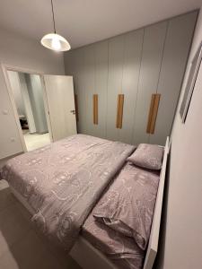 Postel nebo postele na pokoji v ubytování A&A Apartment