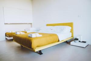 Postel nebo postele na pokoji v ubytování VILLA ZEROU