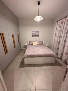 Postel nebo postele na pokoji v ubytování A&A Apartment