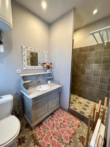 a bathroom with a sink and a shower at UN MOMENT SUSPENDU in Aix-en-Provence +15 photos