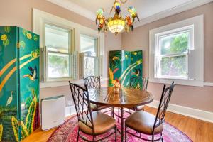 a dining room with a table and chairs and a chandelier at Sarasota Vacation Rental with Private Pool and Lanai! in Sarasota