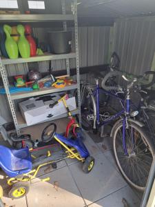 a blue bike parked in a garage with tools at Haus Eifelblick in Gönnersdorf