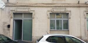 a white car parked in front of a building at MiniLoft Cattaneo in Monza