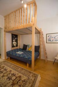 a bedroom with a bunk bed and a staircase at A Lovely apartment near Railway station and Arena. in Tampere