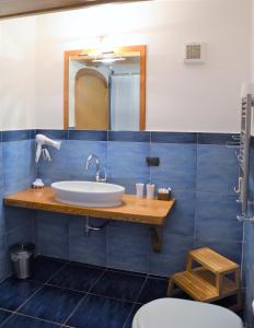 a bathroom with a sink and a mirror at L'Antico Episcopio in Scala