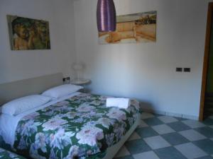 Postel nebo postele na pokoji v ubytování Casale Grandangolo