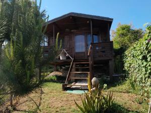a small house with a staircase leading up to it at Casa do Sobreiro 2 in Serra das Alhadas