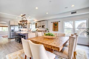 a kitchen and dining room with a wooden table and chairs at Mountaintop Ramona Home Private Pool, Near Lake! in Ramona