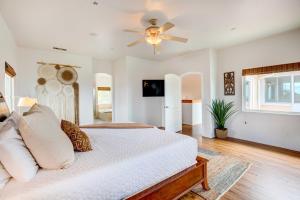 a bedroom with a bed and a ceiling fan at Mountaintop Ramona Home Private Pool, Near Lake! in Ramona