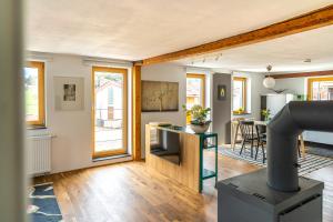 a living room with a kitchen and a dining room at Ausblick Maisenbach, Talstraße in Bad Liebenzell