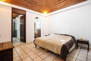 Een bed of bedden in een kamer bij Espectacular casa recién remodelada en Cuernavaca