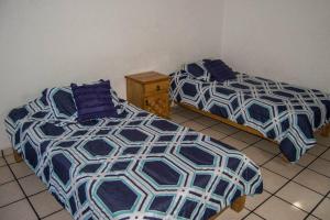 Een bed of bedden in een kamer bij Espectacular casa recién remodelada en Cuernavaca