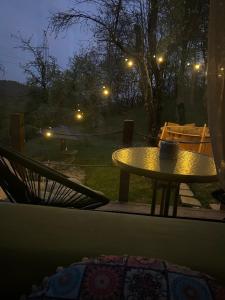 a table with a coffee mug on top of it at Casuta Nest in Curtea de Argeş