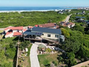 an aerial view of a house with solar panels at A Real Gem in Cape St Francis in Cape St Francis