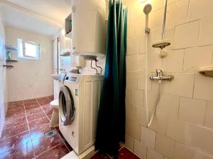 Vannituba majutusasutuses Liget Holiday Home
