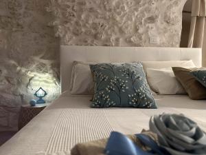 Posteľ alebo postele v izbe v ubytovaní Bianco Calce - Ostuni