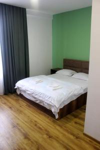 Postel nebo postele na pokoji v ubytování Hotel mia Telavi