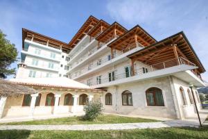a large white building with a balcony at Europa Grand Vlora in Vlorë