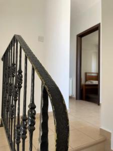 a stairway leading to a room with a mirror at Casa Pernera in Protaras