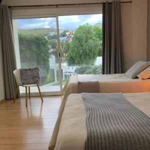Ένα ή περισσότερα κρεβάτια σε δωμάτιο στο Casa Palmeras +36 φωτογραφίες