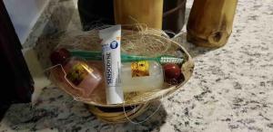 a basket of food with a tube of tooth paste at Suite Antequera en mexico in Oaxaca City