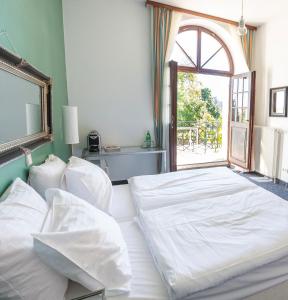 Posteľ alebo postele v izbe v ubytovaní MÖRWALD Grafenegg Hotel