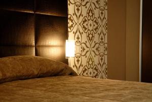 Ein Bett oder Betten in einem Zimmer der Unterkunft Atmosfere Milano Marittima