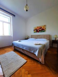 En eller flere senger på et rom på Spalato Relax Apartment