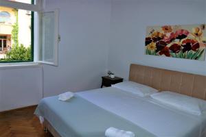 En eller flere senger på et rom på Spalato Relax Apartment