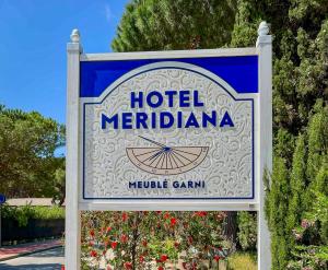 a sign for a hotel meridenma sign at Hotel Meridiana in Marina di Campo