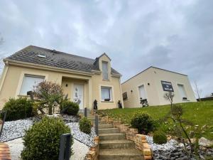 a house with stairs in front of it at Escapade de Vauclair in Bouconville-Vauclair
