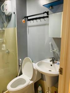 a bathroom with a toilet and a sink at Condo in Avida tower IT park , Lahug Cebu city, Fully furnished in Cebu City