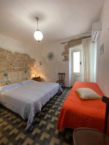 A bed or beds in a room at Window on the Ogliastra apartment in Baunei