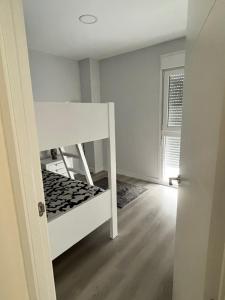 Łóżko lub łóżka w pokoju w obiekcie Piso Palacios