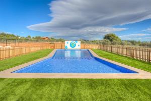 a swimming pool in a yard with a fence at Villa Vilosa - Anna in Anna