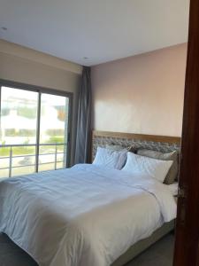 Uma cama ou camas num quarto em HOTEL DEL MAR MAZAGAN