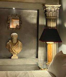 Postel nebo postele na pokoji v ubytování Palazzo storico Colesanti