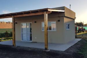 a small house with a cover on top of it at Hermoso alojamiento temporario LA SOÑADA in Pigüé