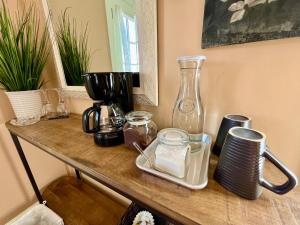 a counter top with a blender and other items on it at Violet Cottage at Zenzen Gardens in Paonia