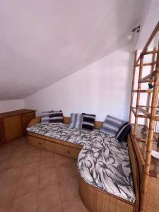 a bedroom with a wooden bed and a ladder at T V B - Vacanze Imperia in Imperia