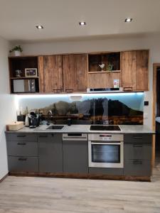 A kitchen or kitchenette at DaHome Appartements