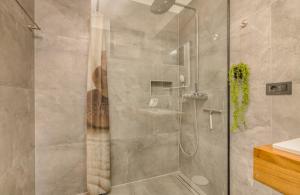 a shower with a glass door in a bathroom at Luxury Villa Weiss - Malinska - heated Pool in Malinska