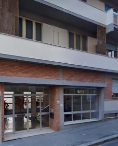 an exterior view of a building with glass doors at Sleep&Go - Appartamento in Florence